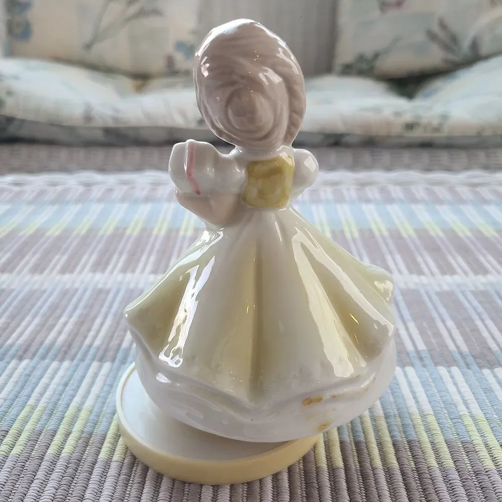 RARE Music Box Figurine With Lovely Young Girl Holding A Gift Plays Look Of Love